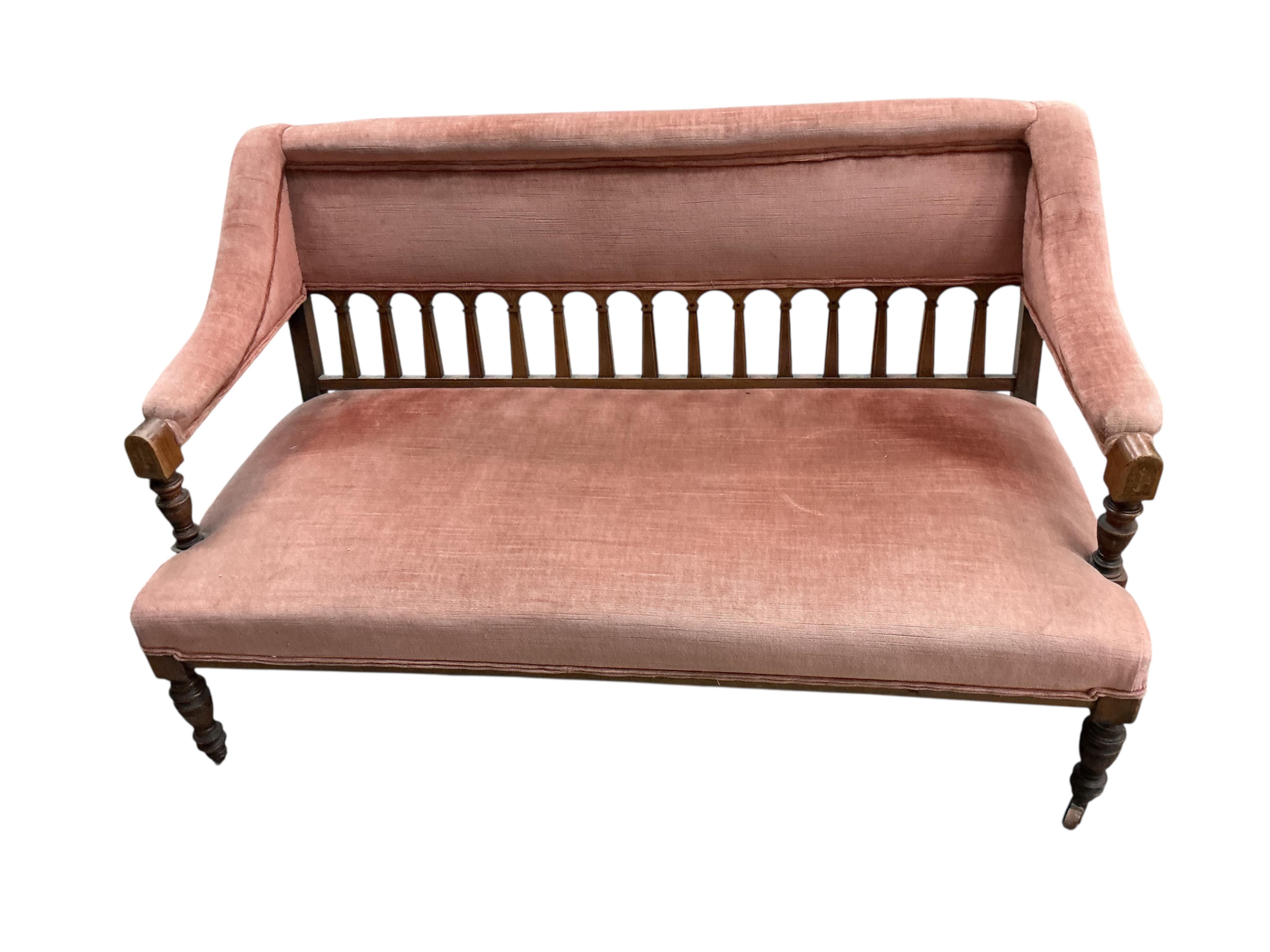 A late Victorian mahogany settee, width 128cm, depth 60cm, height 78cm.
